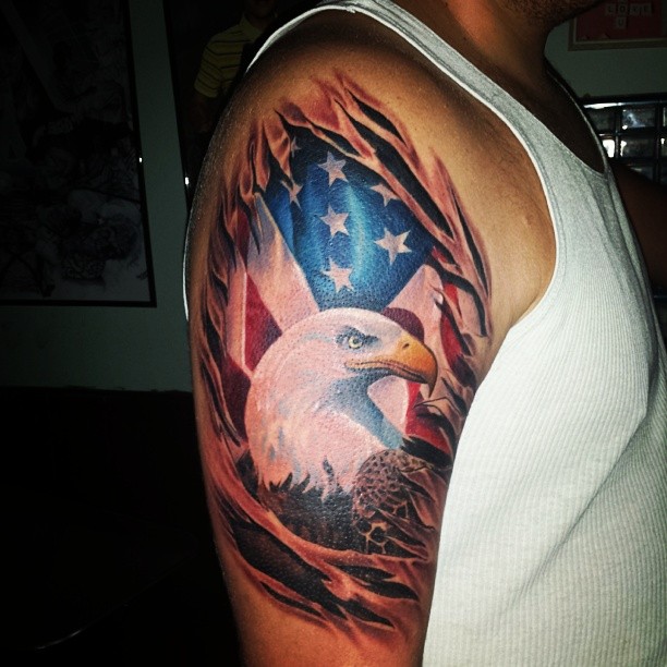 Ripped Skin American Flag With Eagle Tattoo On Right Shoulder