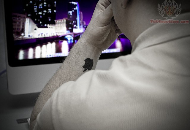 Silhouette Apple Logo Tattoo On Man Left Wrist