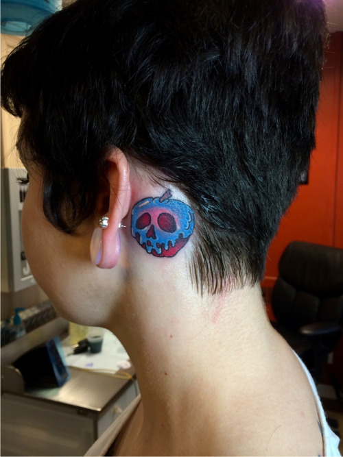 Skull Apple Tattoo On Girl Behind The Ear