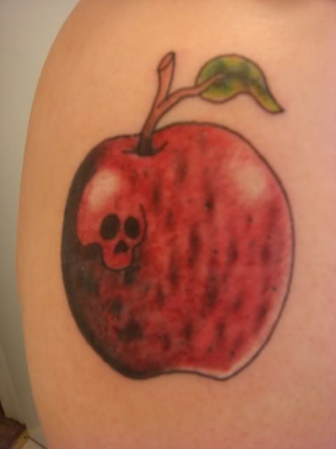 Skull In Red Apple Tattoo Design