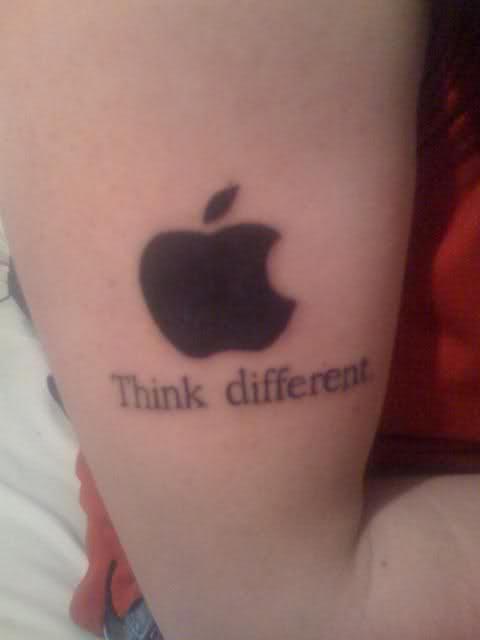 Think Different - Black Apple Logo Tattoo On Bicep