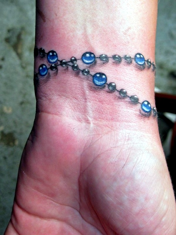 3D Rosary Wristband Tattoo On Wrist