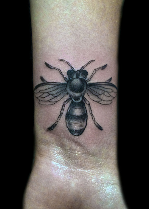 Amazing Black And Grey Bee Tattoo On Wrist