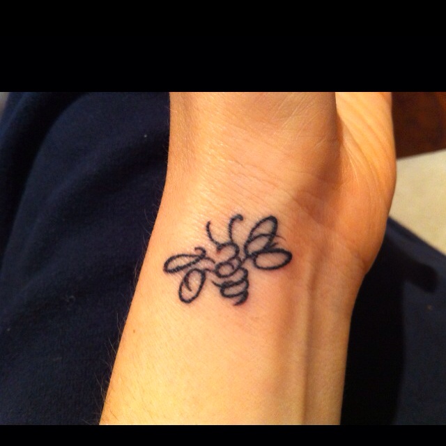 Amazing Black Outline Bee Tattoo Design For Wrist