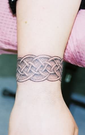 Attractive Celtic Wristband Tattoo On Wrist