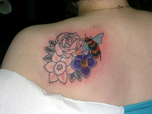 Bee And Flowers Tattoo On Left Back Shoulder