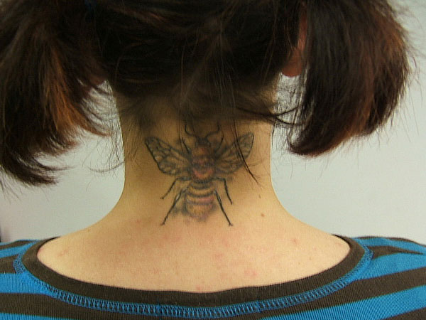 Bee Tattoo On Girl Back Neck