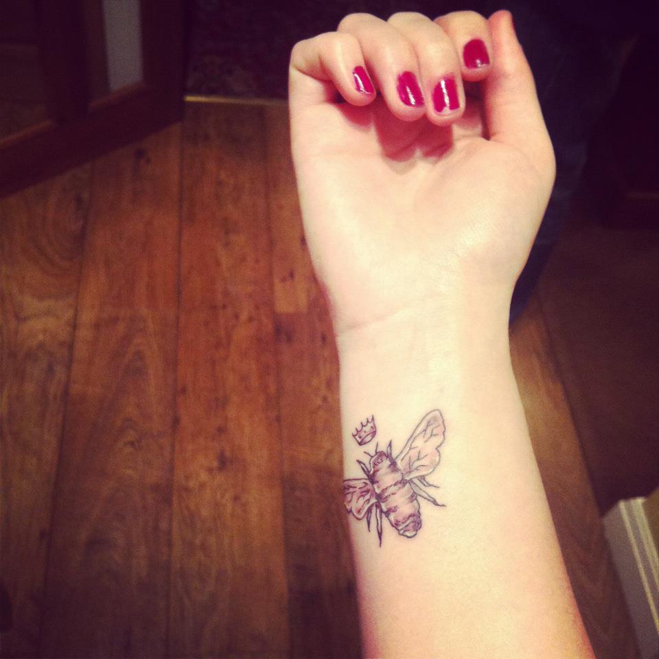 Bee With Crown Tattoo On Girl Wrist