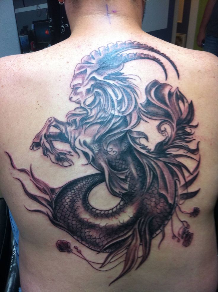 Black And Grey Capricorn Sun Sign Tattoo On Full Back