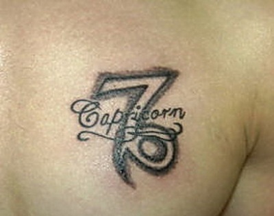 Black And Grey Capricorn Tattoo On Chest