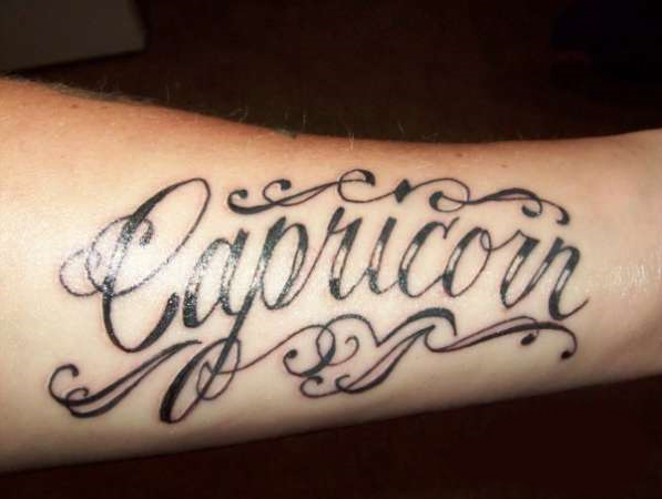 Black And Grey Capricorn Tattoo On Forearm