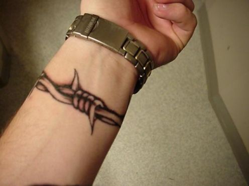Black Barbed Wristband Tattoo On Wrist