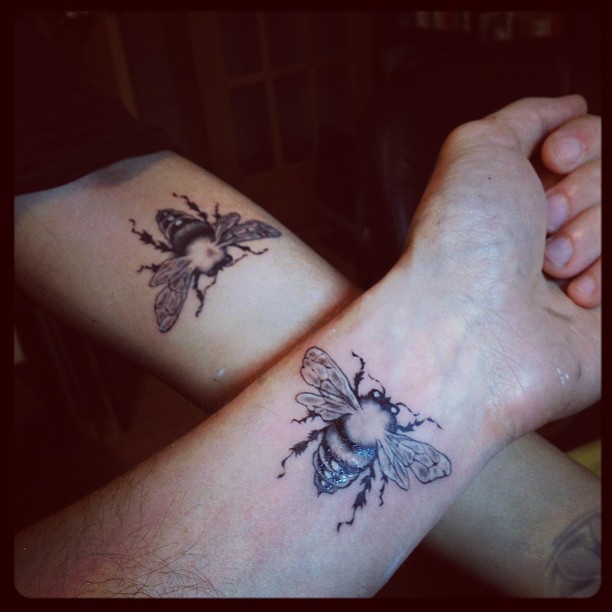 Black Bee Tattoo On Couple Forearm