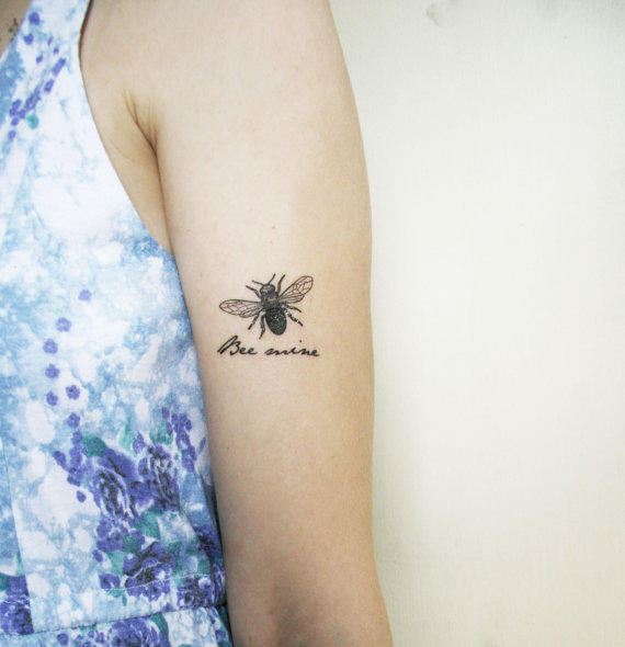 Black Little Bee Tattoo On Left Bicep