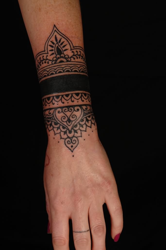 Black Mandala Wristband Tattoo On Girl Upper Wrist
