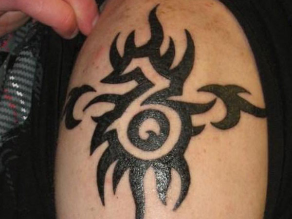 Black Tribal Capricorn Tattoo On Leg