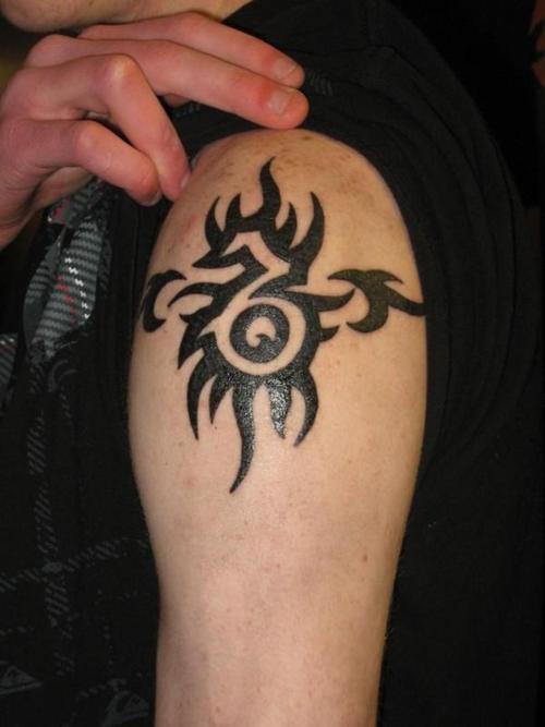 Black Tribal Zodiac Capricorn Tattoo On Shoulder For Men