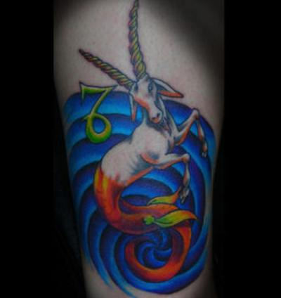 Blue Water And Color Capricorn Tattoo On Leg