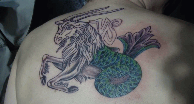 Capricorn Tattoo On Man Upper Back