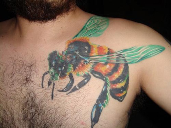Colorful Bee Tattoo On Man Left Front Shoulder
