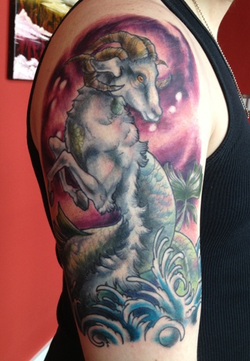 Colorful Capricorn Tattoo On Man Right Half Sleeve