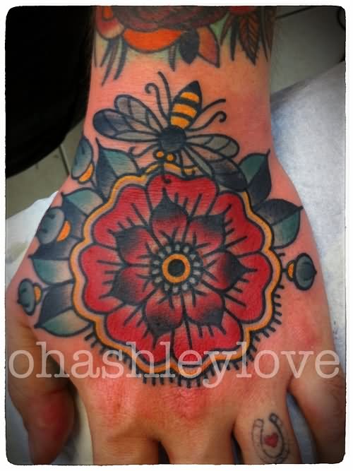 Colorful Traditional Bee And Flower Tattoo On Hand