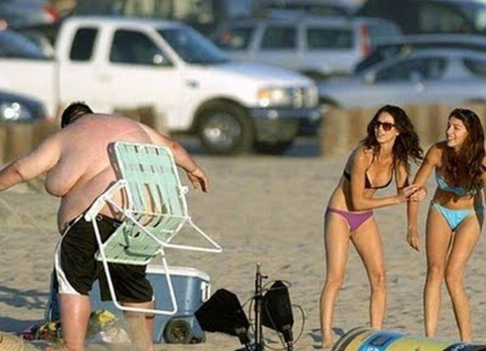 Fat Man Stuck In Chair On Beach Funny Picture