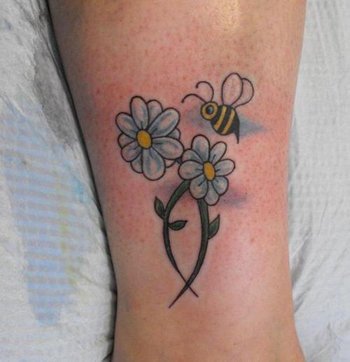 Flying Bee With Flowers Tattoo Design For Leg