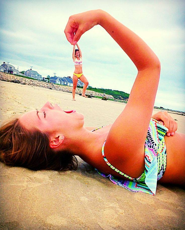 Girl Eating Funny Illusion On Beach Picture