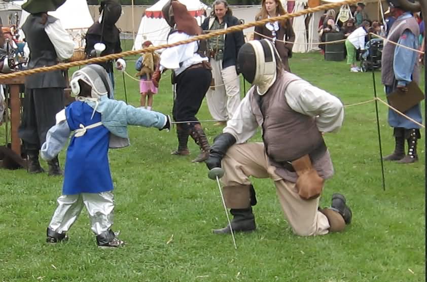 Kid Fencing With Man Funny Image