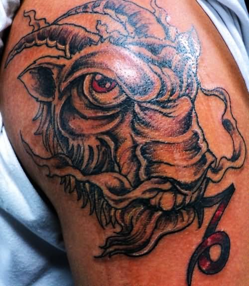 Red Eye Capricorn Head Tattoo On Shoulder