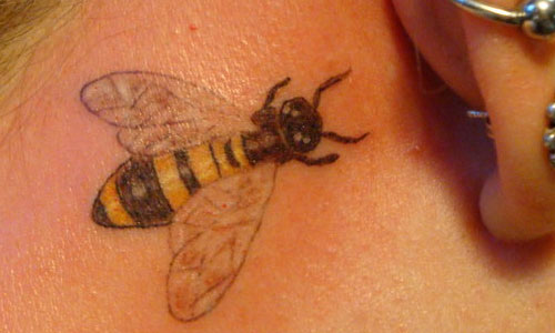Simple Bee Tattoo On Behind The Ear