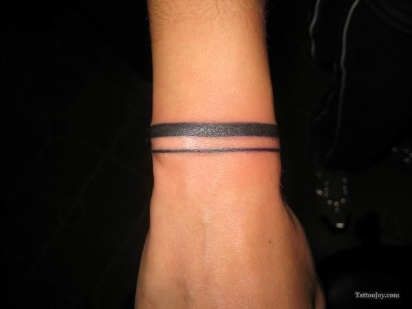 Simple Black Line Wristband Tattoo On Wrist