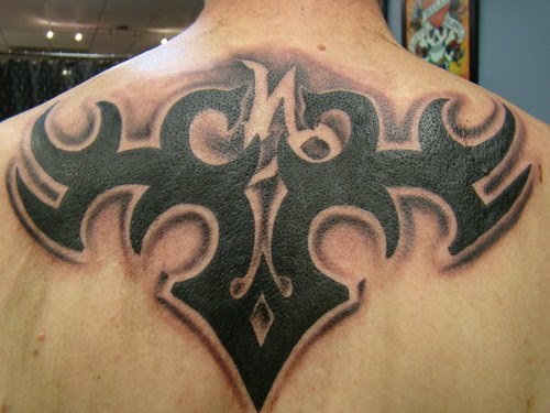 Tribal Capricorn Tattoo On Upper Back For Men