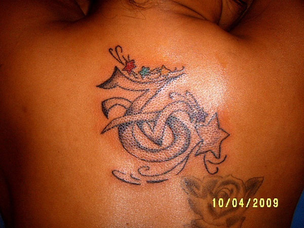 Upper Back Girly Capricorn Tattoo