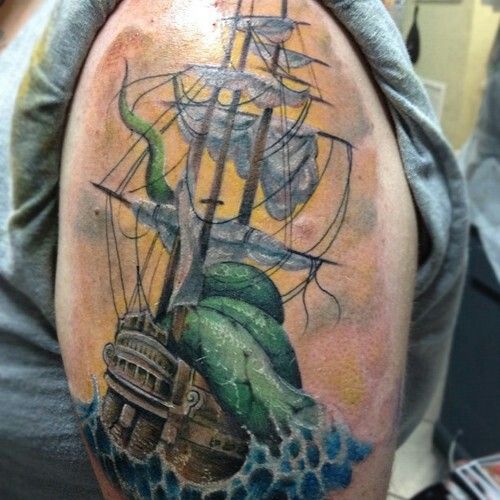 Amazing Kraken Attacking Ship Tattoo On Shoulder