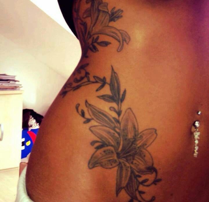 Amazing Lily Flowers Tattoo On Side Belly
