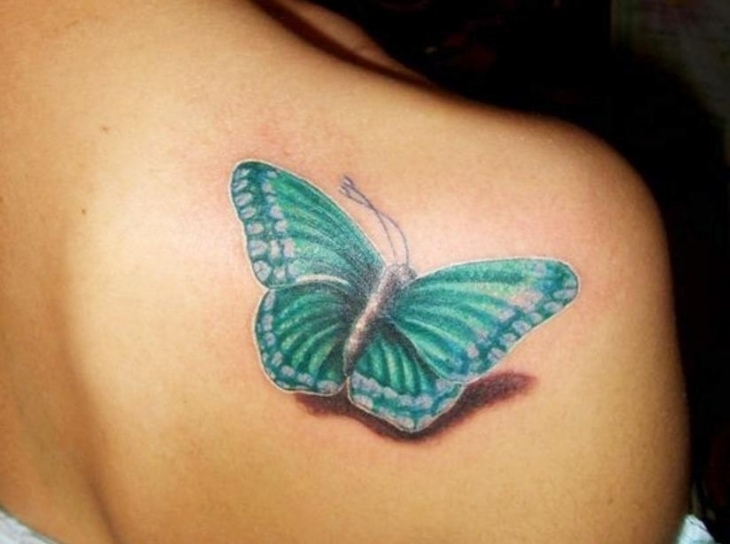 Aqua Butterfly Tattoo On Right Back Shoulder