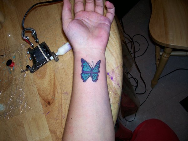 Aqua Butterfly Tattoo On Wrist