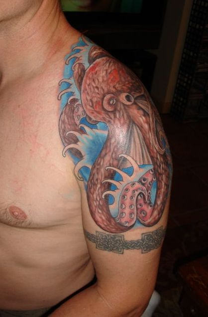 Armband And Octopus Tattoo On Man Shoulder
