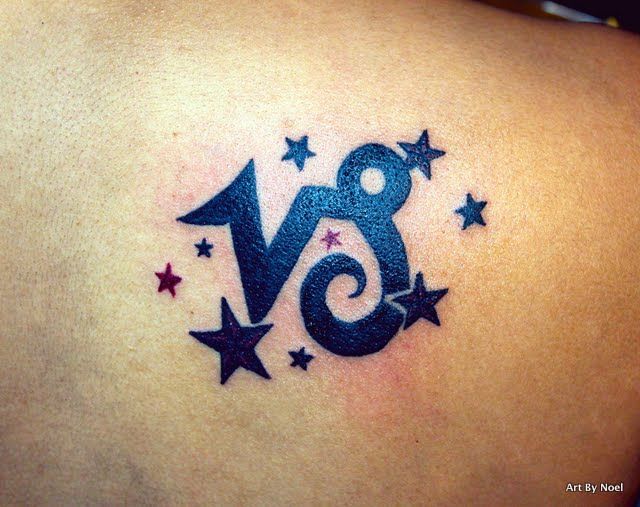 Awesome Black Stars And Capricorn Tattoo On Back Body