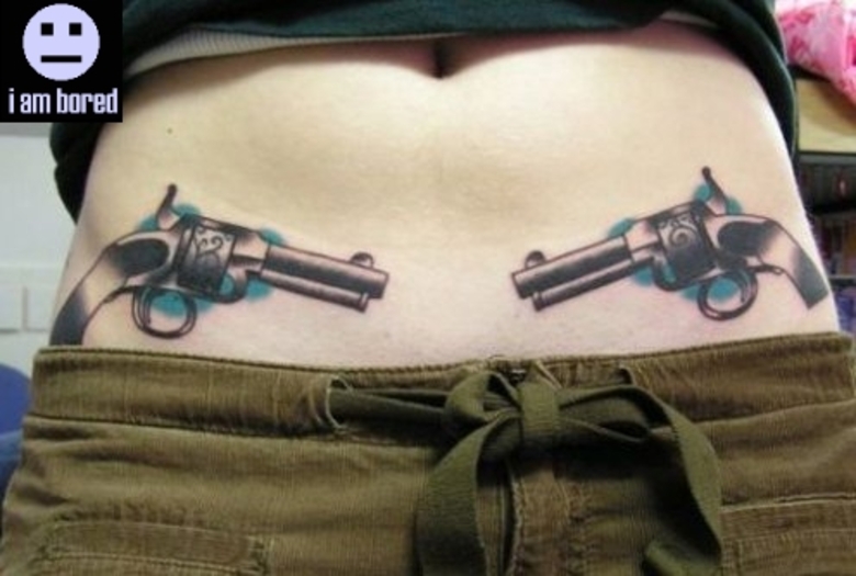 Awesome Two Guns Tattoo On After Pregnancy Belly