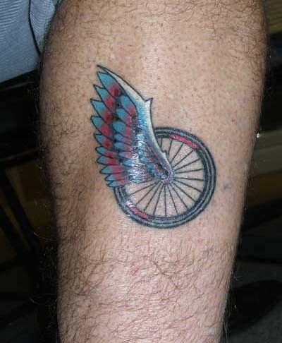 Bike Wheel With Wing Tattoo Design For Leg