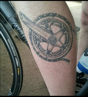 Black And Grey Bike Gear Tattoo On Leg Calf