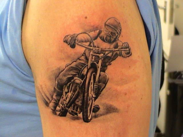 Black And Grey Biker Tattoo On Shoulder