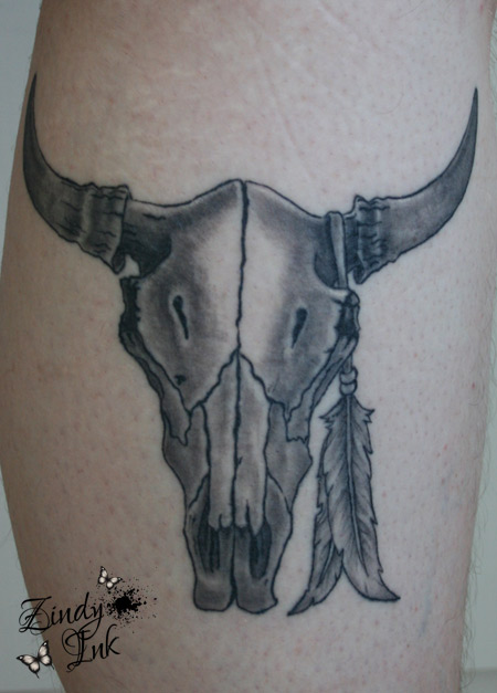 Black And Grey Cow Skull With Feather Tattoo Design