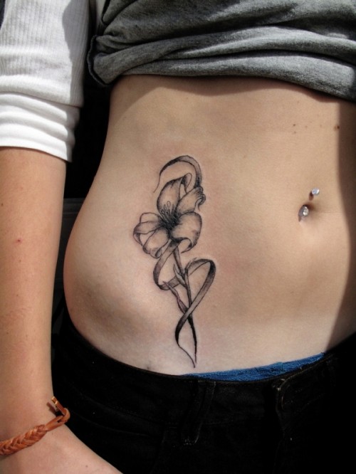 Black And Grey Flower Tattoo On Girl Belly