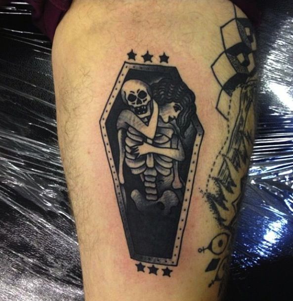 Black And Grey Skeleton Coffin Tattoo On Leg