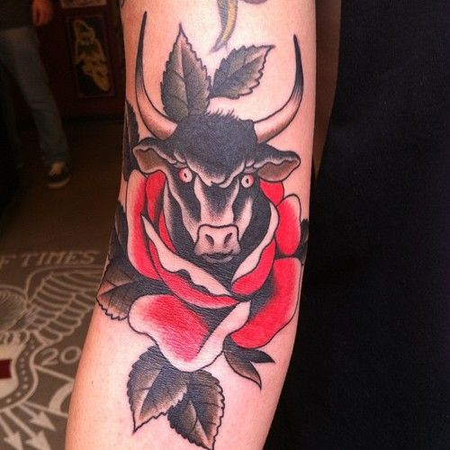 Black And Red Traditional Cow Head In Rose Tattoo Design For Sleeve
