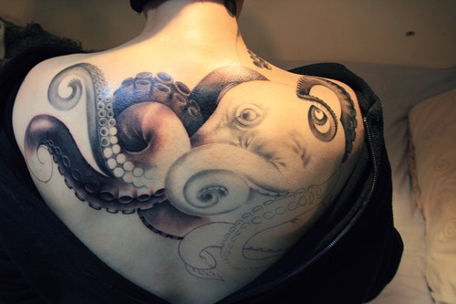 Black And White Octopus Tattoo On Upper Back